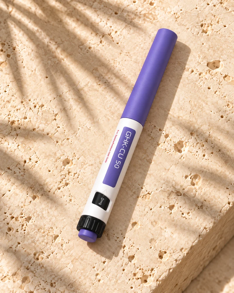 GHK-Cu pen on a stone surface